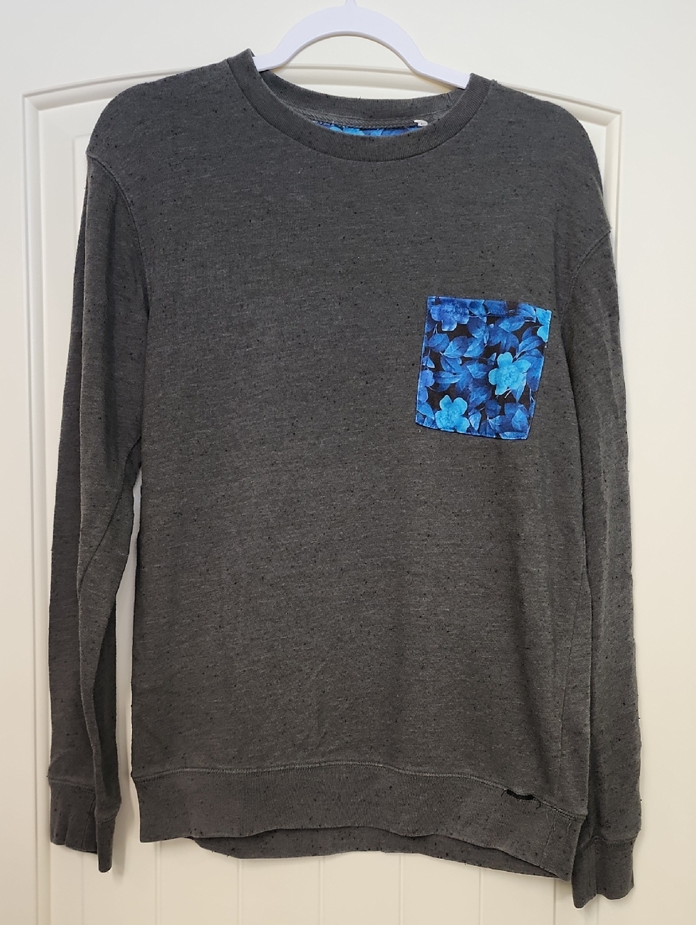 on the byas Men's Charcoal Crewneck Sweater with Blue Floral Pocket